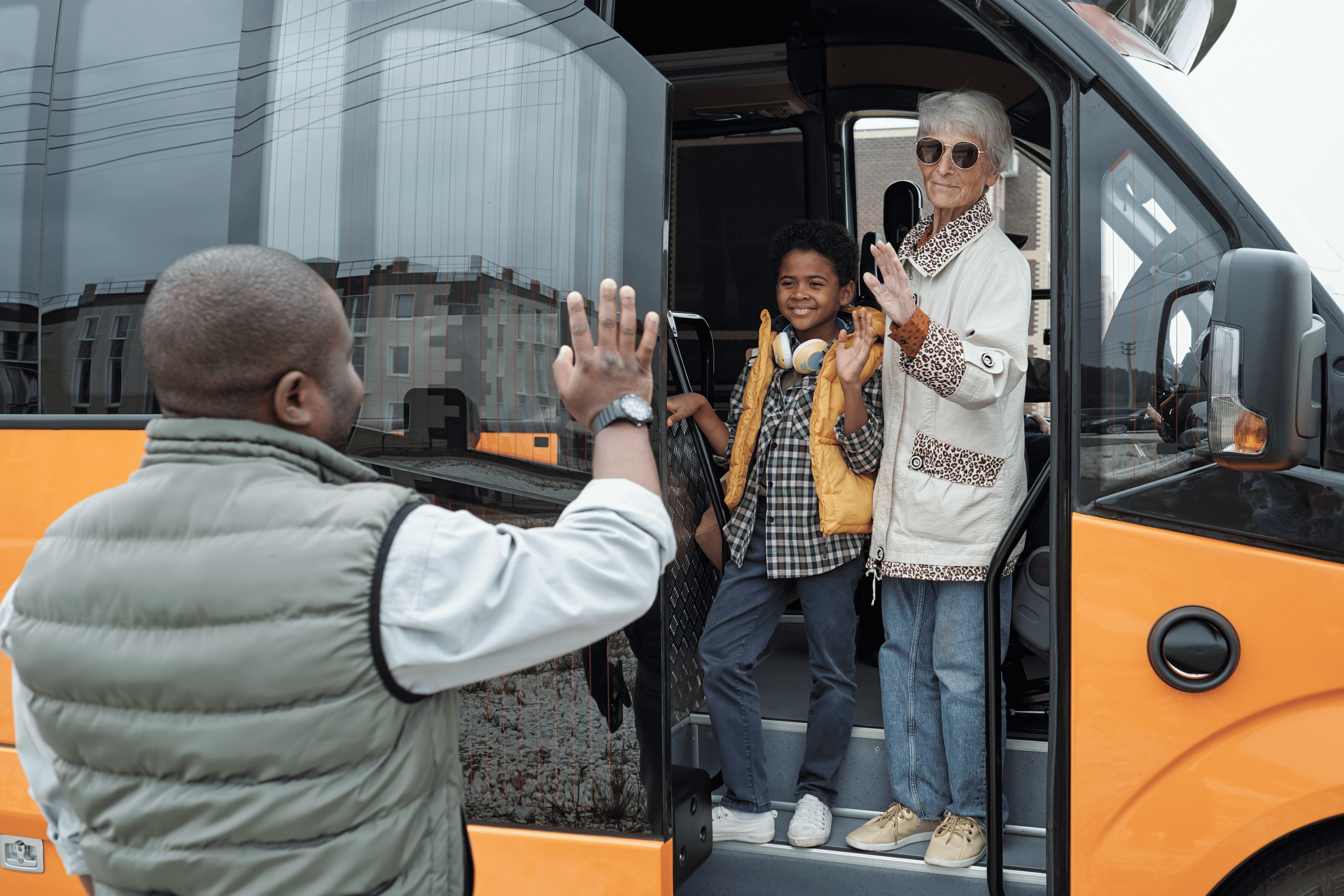 Students boarding a minibus for a school outing in Renfrewshire
